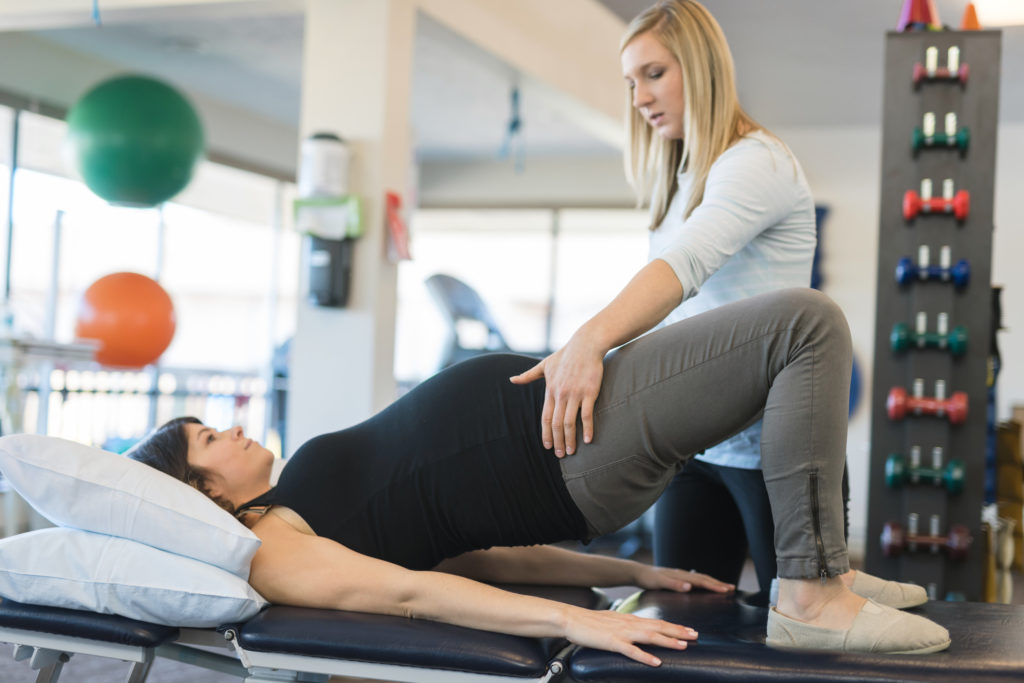 Pregnant woman doing physical therapy