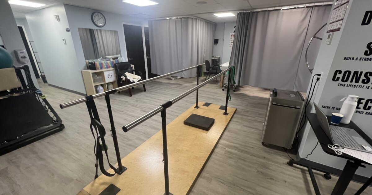 ProKinetics Physical Therapy treatment floor with parallel bars for gait and balance training